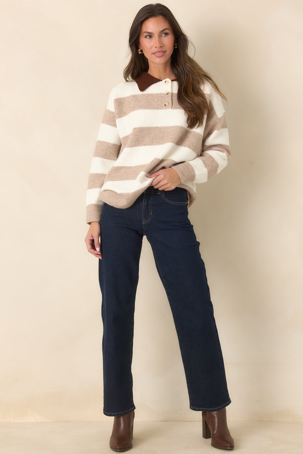 Model wearing Straight Talk dark wash low-rise straight-leg jeans with contrast stitching and finished hems, front view.