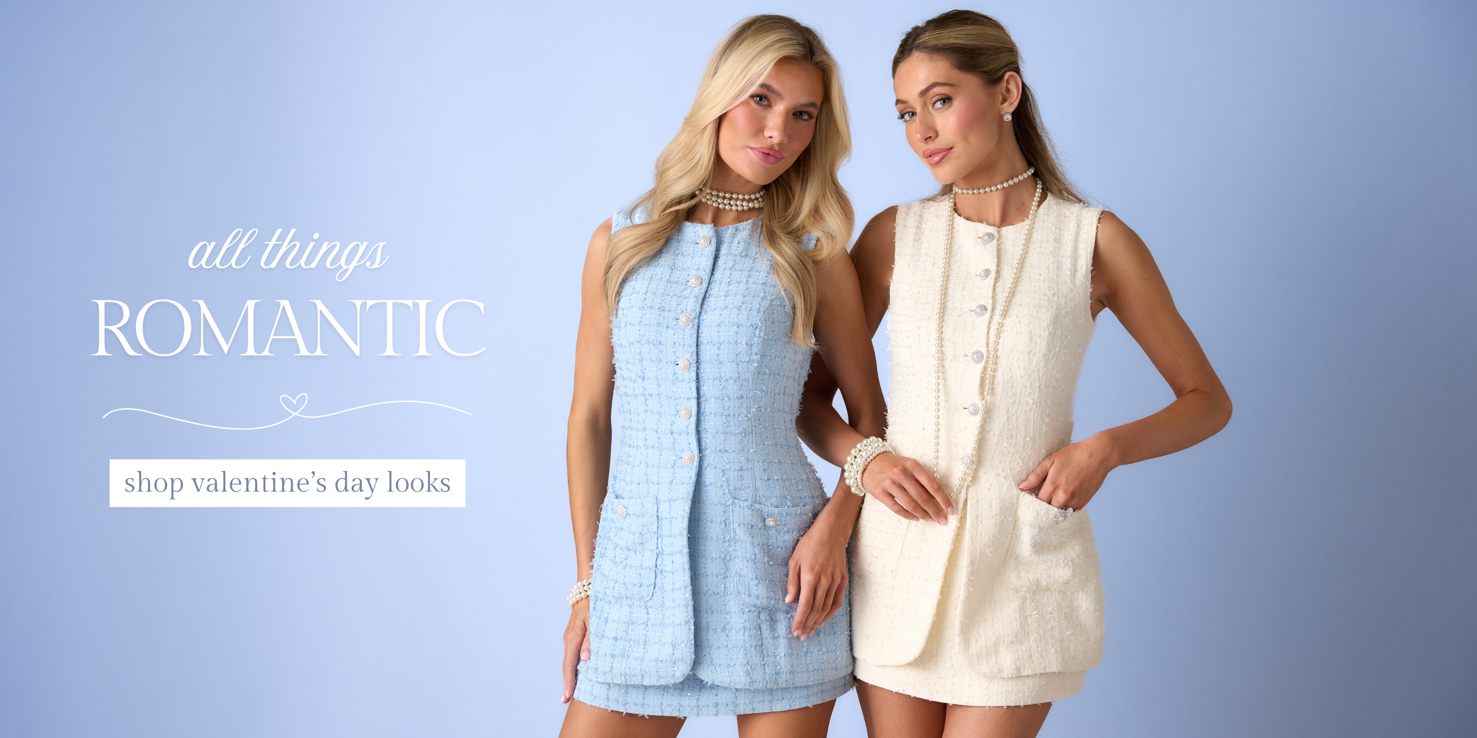 Two models wearing romantic sleeveless dresses in blue and cream, styled with pearl accessories for a women’s Valentine’s Day clothing collection.