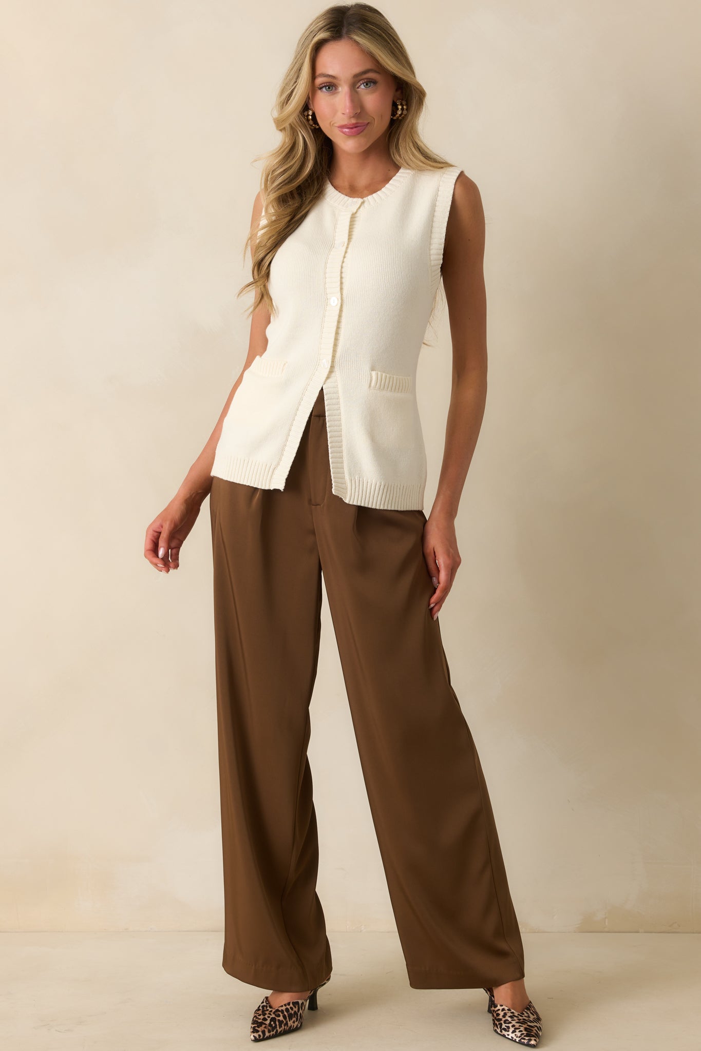 Vest styled with front patch pockets and a relaxed sleeveless fit.