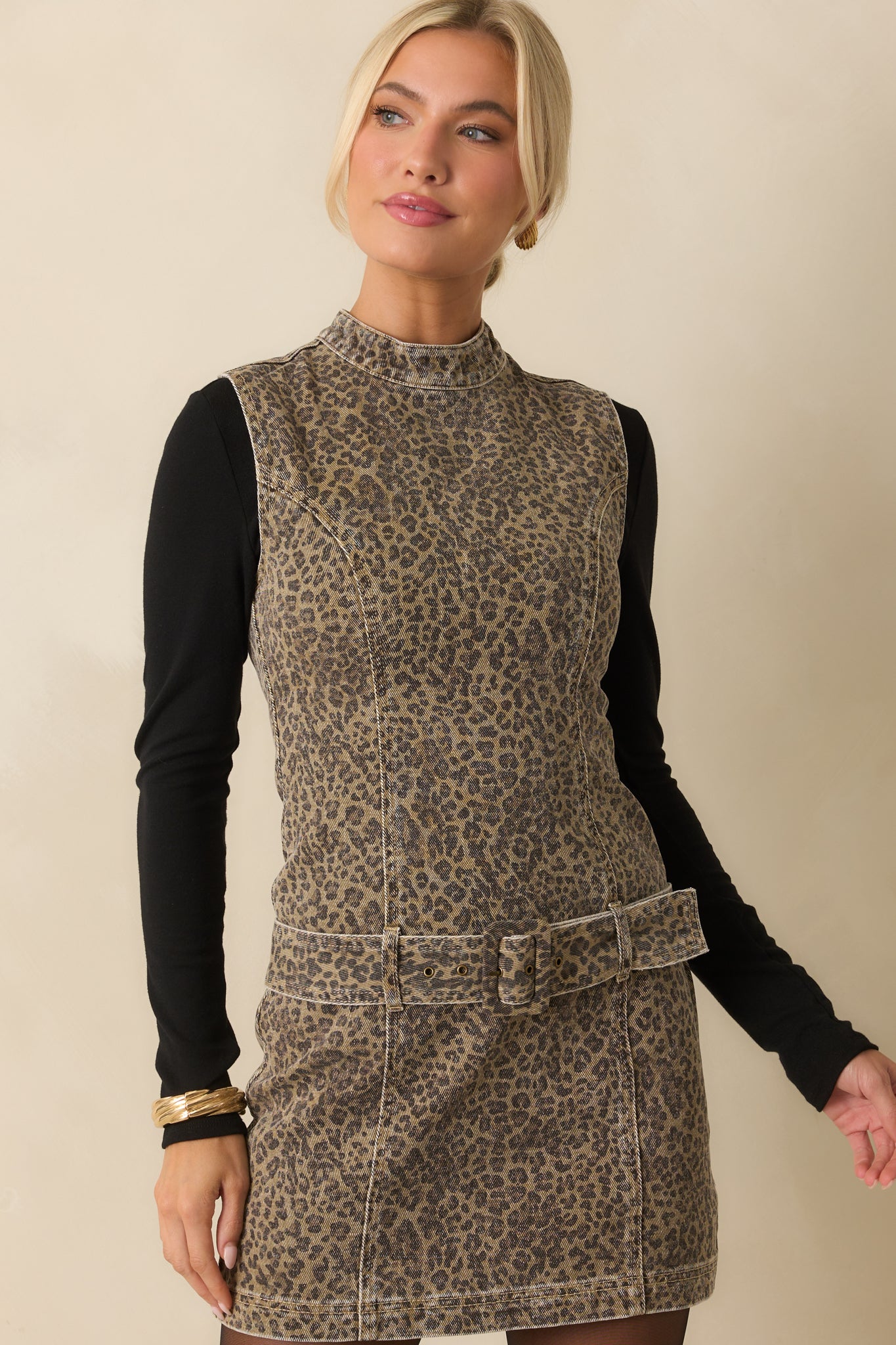 Waistline and front paneling detail visible on the structured denim dress.