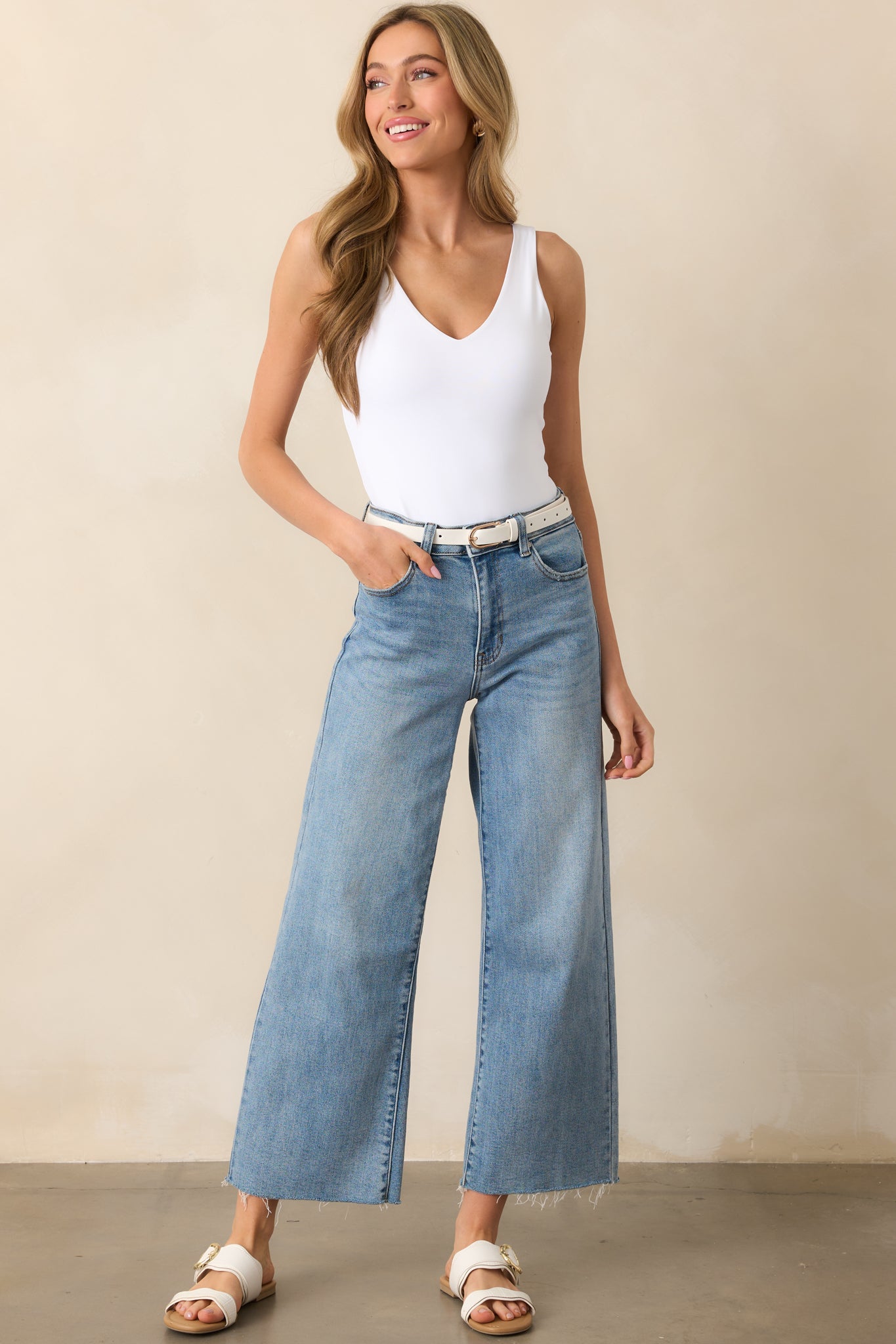 A slightly angled perspective of the bodysuit, highlighting the soft material and flattering cut.