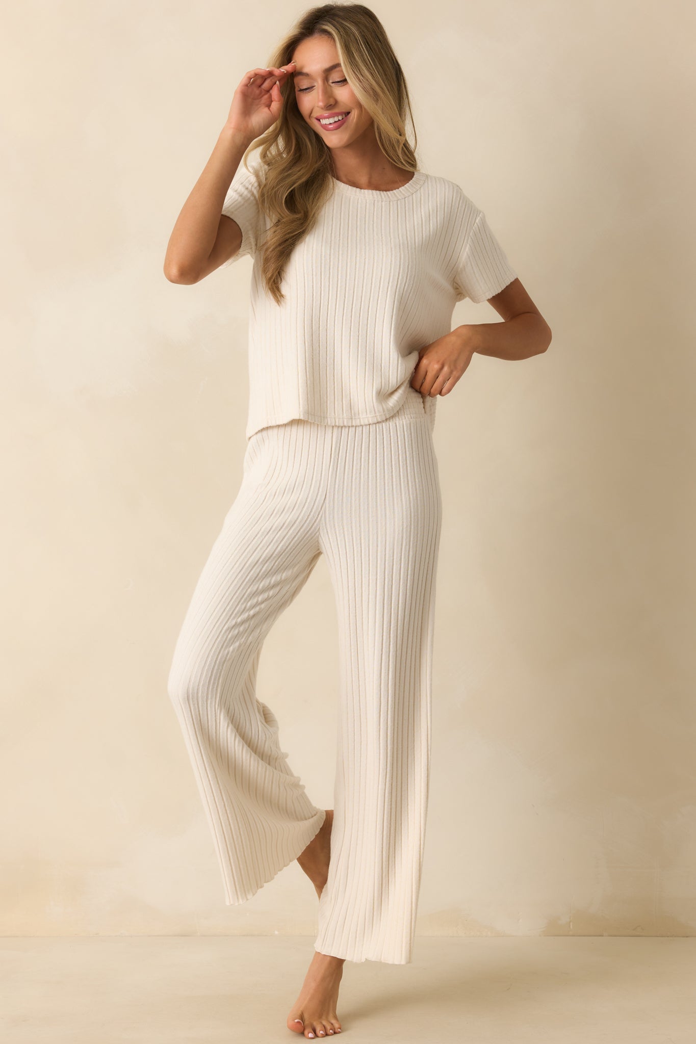 Wide leg ivory pants designed with a soft ribbed texture for all-day comfort