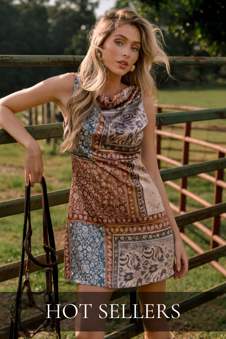 Printed sleeveless mini dress in warm fall tones, featured in the Hot Sellers shop.