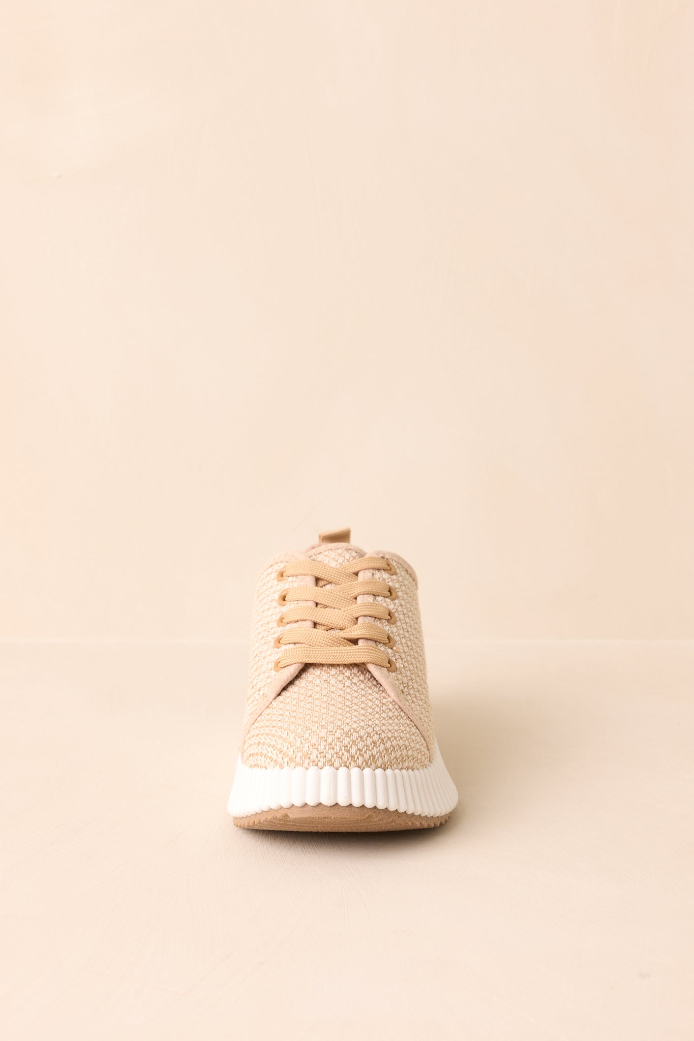 Detailed texture of woven fabric and thick white rubber platform sole.