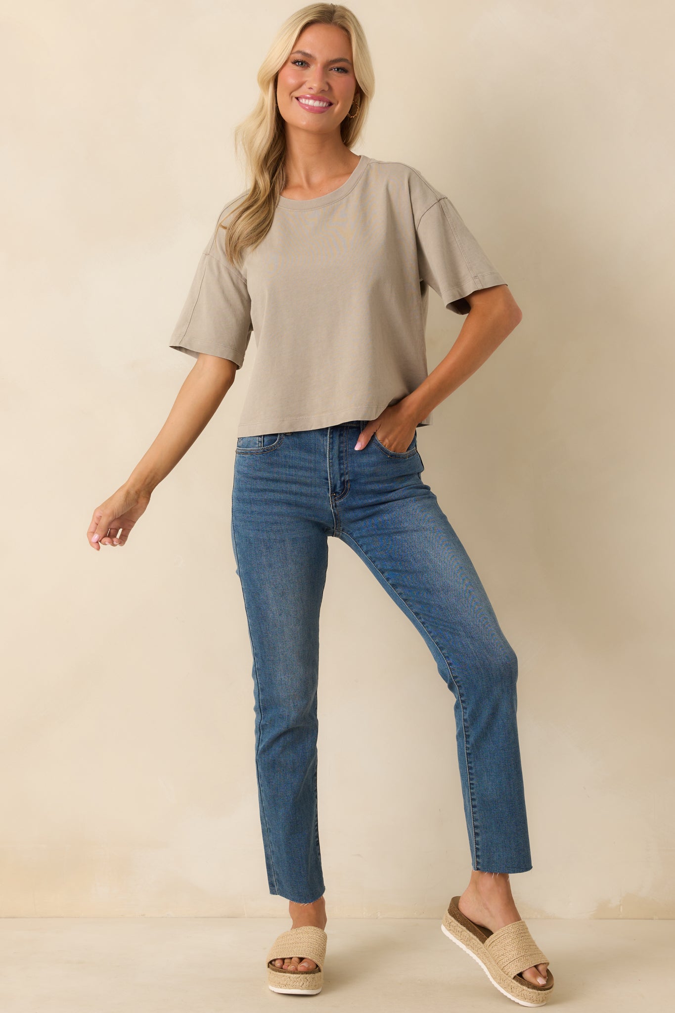 Front view of a taupe tee with a crew neckline, short sleeves, and a relaxed fit.