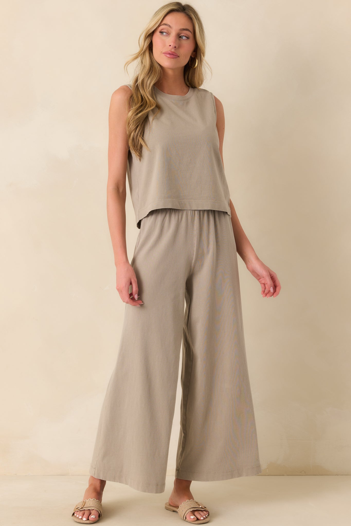 A full front view of the taupe pants showcasing the wide leg design and high waisted fit.