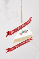 Top view of this ornament that features a brie inspired design with 