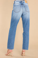 Back view of  these jeans that feature a tapered leg, seam detailing, functional front and back pockets, and belt loops.
