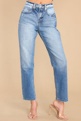 Front view of these jeans that feature a tapered leg, seam detailing, functional front and back pockets, and belt loops. 
