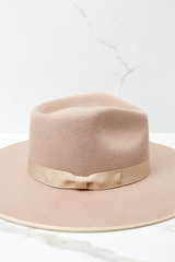 This sand colored rancher fedora hat features stiffened wool with rigid crown design and trim on rim with tonal gross grain ribbon.