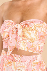 Close up view of this set that features a strapless top with a self tie bow, smock stretch detail on the back,