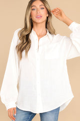 Front view of this top that features a collared neckline, functional buttons down the bodice, and one pocket on the bust.