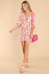 Full body view of this dress that showcases the floral print of the fabric.