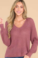 Front view of this sweater that features a subtle v-neckline.