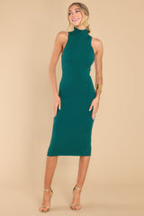Front view of this mock-neck dress that features a sleeveless design with wide openings, a bodycon silhouette, and a ribbed material containing stretch throughout.