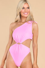 Front view of this swimsuit that features a one shoulder neckline, adjustable tie on the shoulder, no padding through the bust, cut-outs on the waist, moderate coverage, and a high leg.