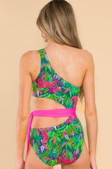 Back view of this one piece that features a one shoulder, removable pads, cut out on the side, self-tie around the waist, and medium coverage.