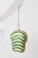 This green ornament features an avocado toast design.