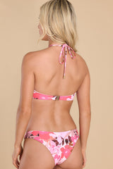 Back view of this bandeau bathing suit that top features a self-tie around the neck, a gold hoop detail, and a clasp clip in the back.