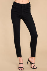 These black Jeans feature a front zipper, front and back functional pockets, and a raw hemline at the ankle.