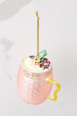 Top view of this ornament that features a drink-like design with glitter writing across.