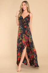 Full body view of this dress that showcases the floral pattern of the black fabric.