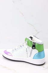 Inner-side view of these shoes that feature a high top design, multi colors throughout, and additional laces.