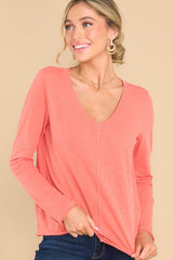 Front view of this top that features distressed detailing on the hem.
