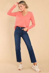 Full body view of this top that features a v-neckline, long sleeves and a seam detail in the middle.