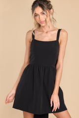 Front view of this dress that features a square neckline and adjustable shoulder straps.
