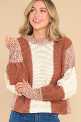 Front view of this sweater that features a striped colorblock design.