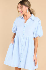 Front view of  this dress that features functional waist pockets.