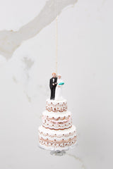 This white wedding cake ornament measures 7