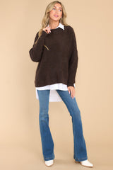 Full body view of this sweater that features a mock neckline, bold seam detailing, a ribbed hem and cuffs, and a soft, knit material.