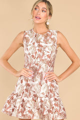 Front view of this dress that features a round neckline, a slight fit and flare silhouette, and a bottom flared skirt.