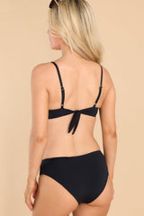 Back view of this bikini top that features wired cups with removable pads, adjustable thin straps, and a self-tie back closure.