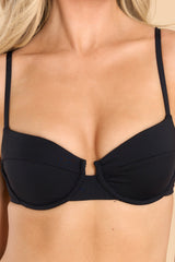 Close up view of this bikini top that features wired cups with removable pads, adjustable thin straps, and a self-tie back closure.