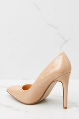 Inner-side view of these pumps that feature a pointed toe, side seaming, and a thin heel.