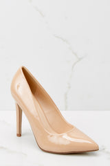 Angled front view of these pumps that feature a pointed toe, side seaming, and a thin heel.