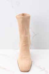 Front view of tan high heel booties with a soft suede texture throughout. 