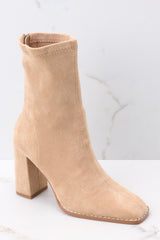 Outside view of tan booties featuring a square toe, and a block heel. 