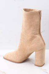 Inside view of tan booties with a functional zipper down the back, and 