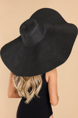 Back view of this hat that features a wide brim, elastic under the chin, and offers UV protection.