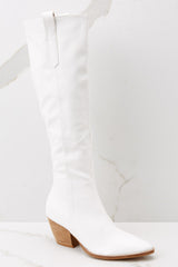 Outside view white high heel boots featuring a pointed toe and a stacked heel. 