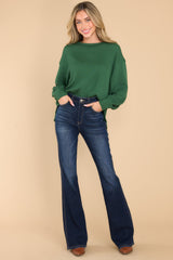 Full body view of this top that features a round neckline, subtle bubble sleeves, a bottom hem that is approximately 2