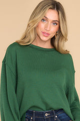 Front view of  this top that features a round neckline and subtle bubble sleeves.