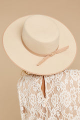 Back view of this hat that is trimmed with tonal Light Gold gross grain edged hat rim and back tie ribbon detail and crown complete with dome down brim.