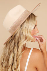 Side view of this hat that is featuring a trim with a tonal grosgrain ribbon.