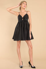 Full body view of this dress that features a sweetheart neckline with a key hole detail on the bust and a baby-doll silhouette.