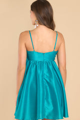 Back view of this dress that features a sweetheart neckline with a keyhole detail on the bust, the bow at the bust is non-adjustable, adjustable spaghetti straps, zipper on the back, and a babydoll silhouette.